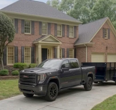 Truck delivering the dump trailer to a driveway