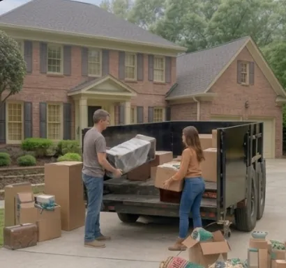 Loading furniture and boxes into the dump trailer